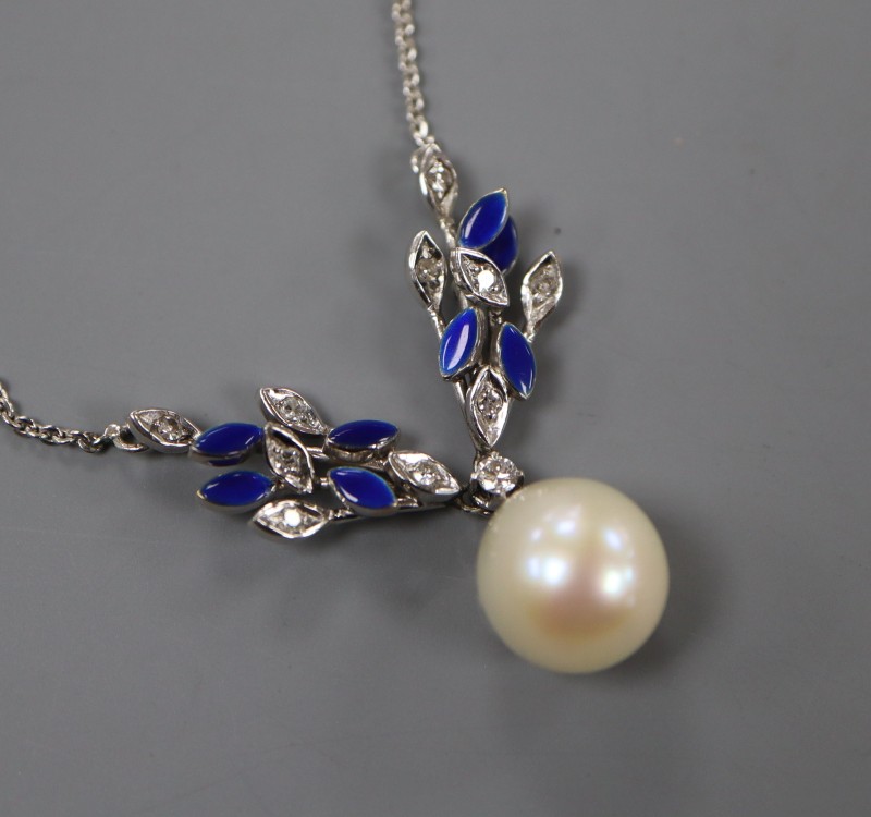 A modern white metal, cultured pearl, diamond and blue enamel set drop pendant necklace, pendant 31mm, chain 37cm, gross 6.3 grams.